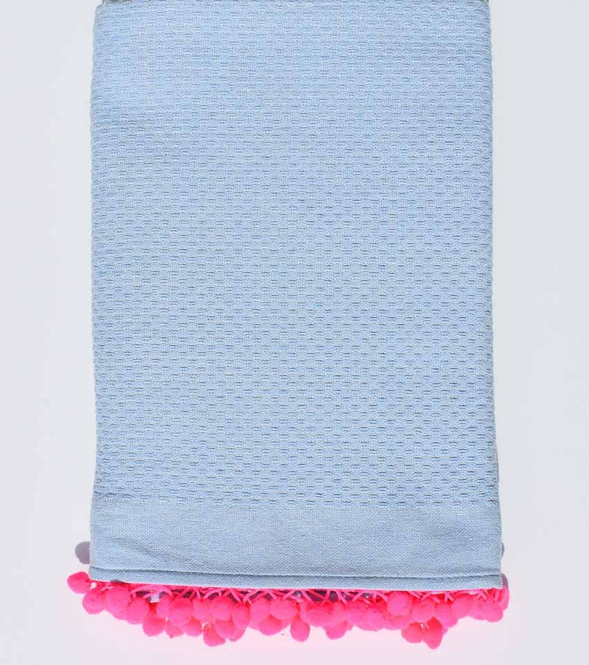 Fouta en nid d'abeille unie bleu clair avec pompons rose fluo Fouta Tunisia - 1