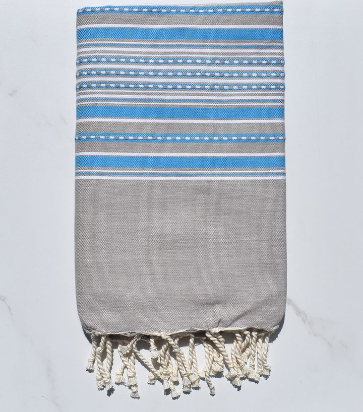 Fouta arabesque taupe clair avec rayures bleu 