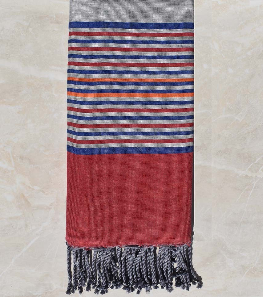 Jeté gris avec rayures framboise, bleu et orange 