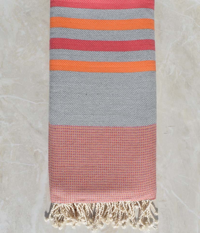Jeté chevron gris, rose et orange 